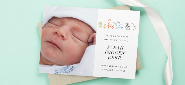 Baby Birth Announcements A baby birth announcement card with printed toy animals sat on a brown envelope. The card shows a photo and birth details of a new-born baby girl.