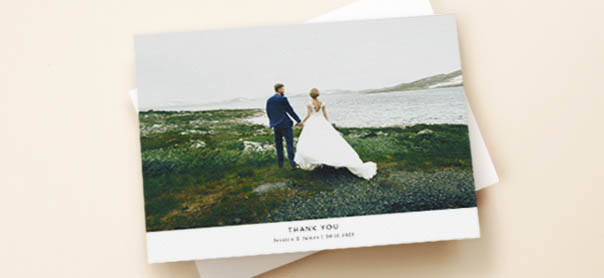 Wedding Thank You Cards A wedding thank you card with a full photo of the bride and groom. It is printed with a personal message.